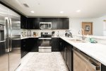 Gorgeous new kitchen with granite counters and stainless steel appliances